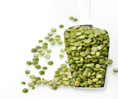Dry Green Peas In A Measuring Spoon