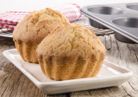 freshly baked muffins on cream colored plate
