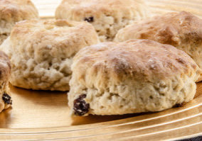 home made raisins scones on a plate