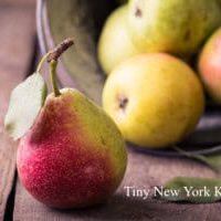 pears lying on an old obsolete wooden table