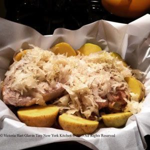 Pork chops and potatoes under sauerkraut