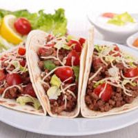 beef tacos with salad and tomato
